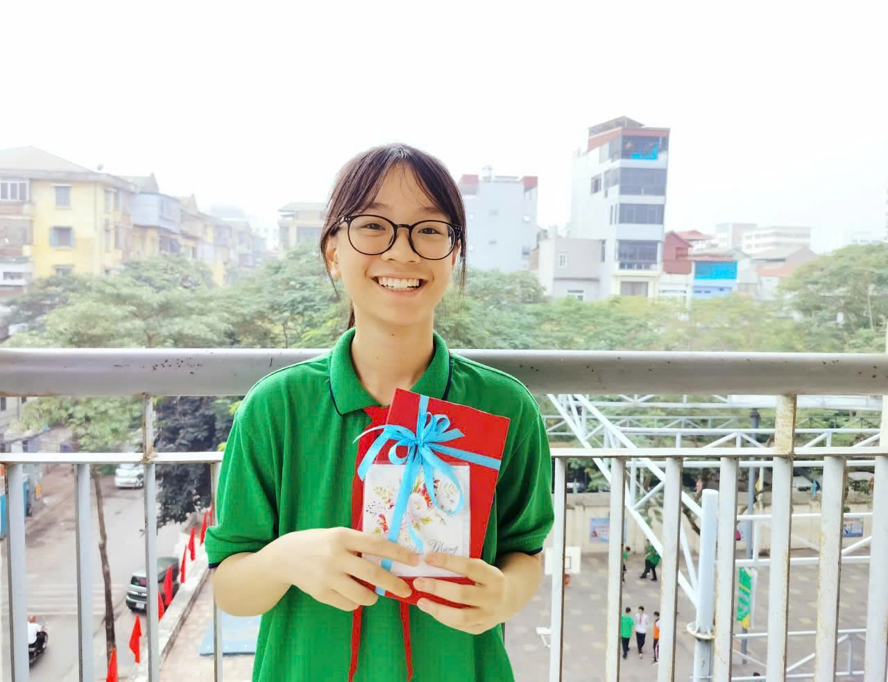 A person holding a giftDescription automatically generated