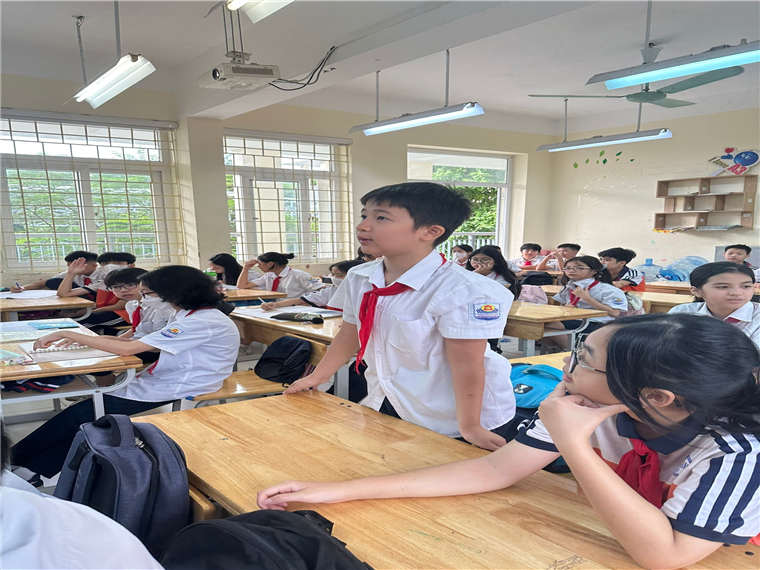 A group of students in a classroomDescription automatically generated