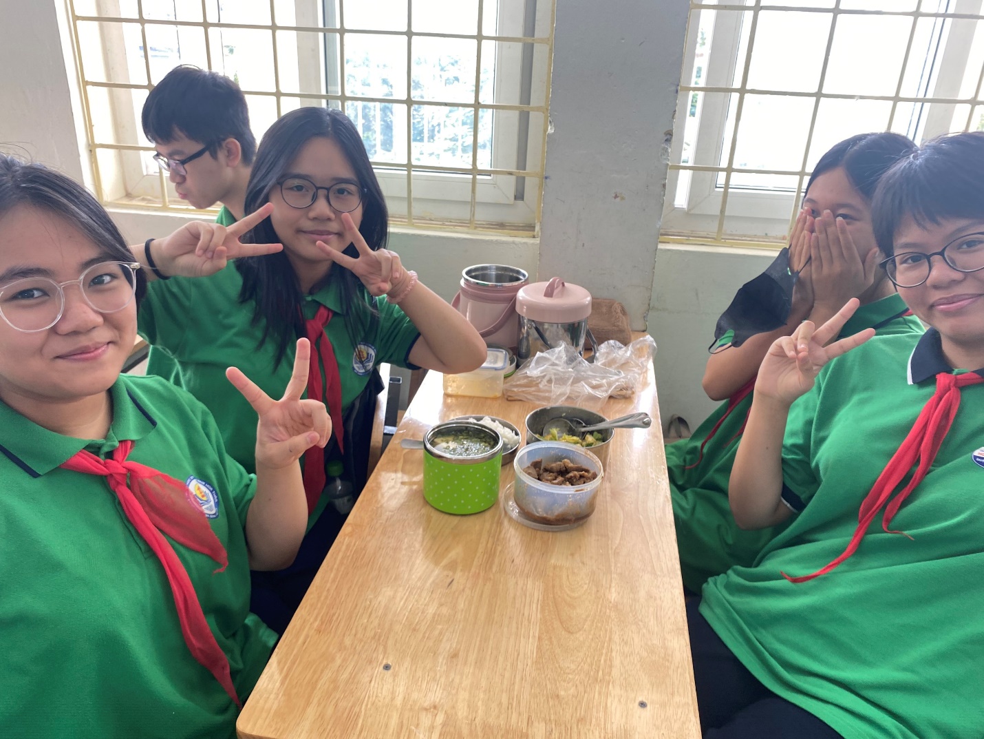 A group of people sitting at a table

Description automatically generated