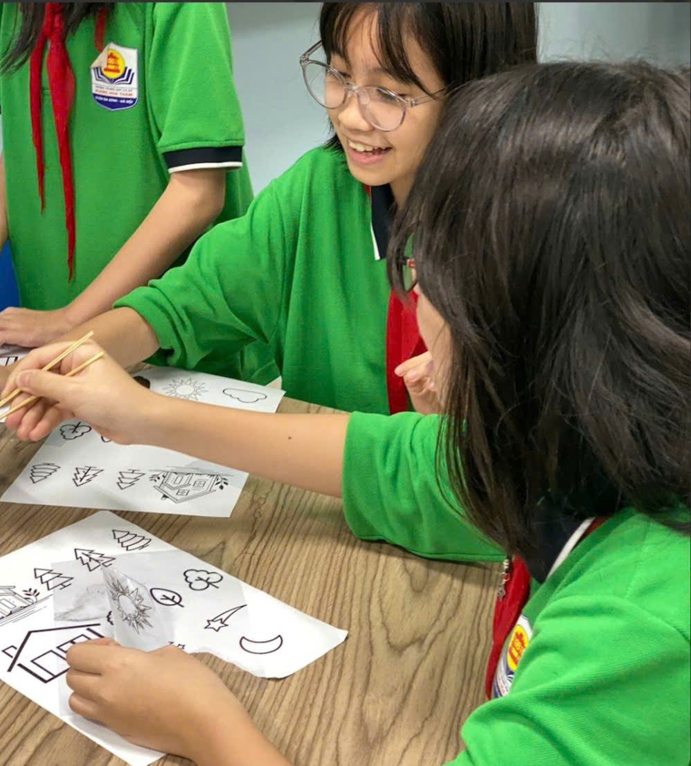 A group of girls in green shirtsDescription automatically generated