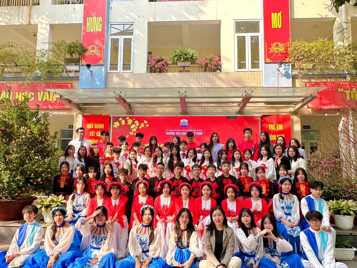 A group of people posing for a photoDescription automatically generated