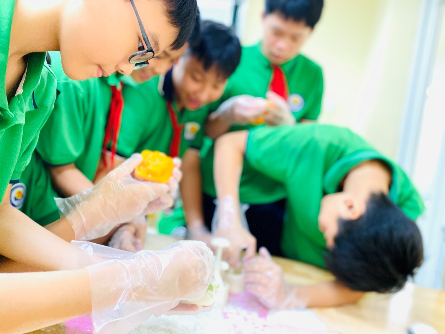 A group of young boys in green shirts
AI-generated content may be incorrect.
