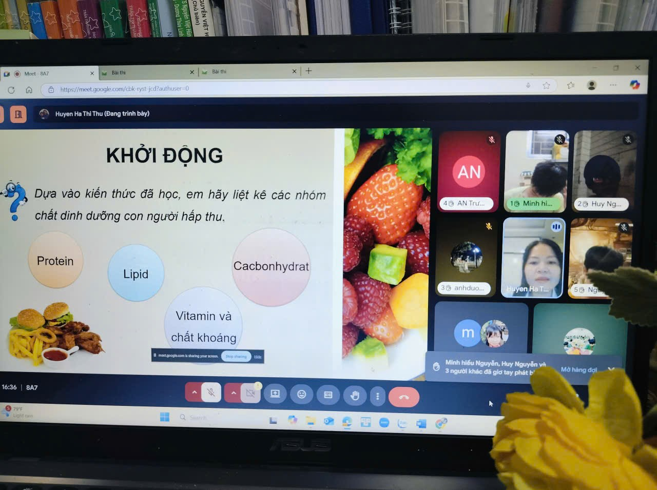 A computer screen with a yellow flower
Description automatically generated