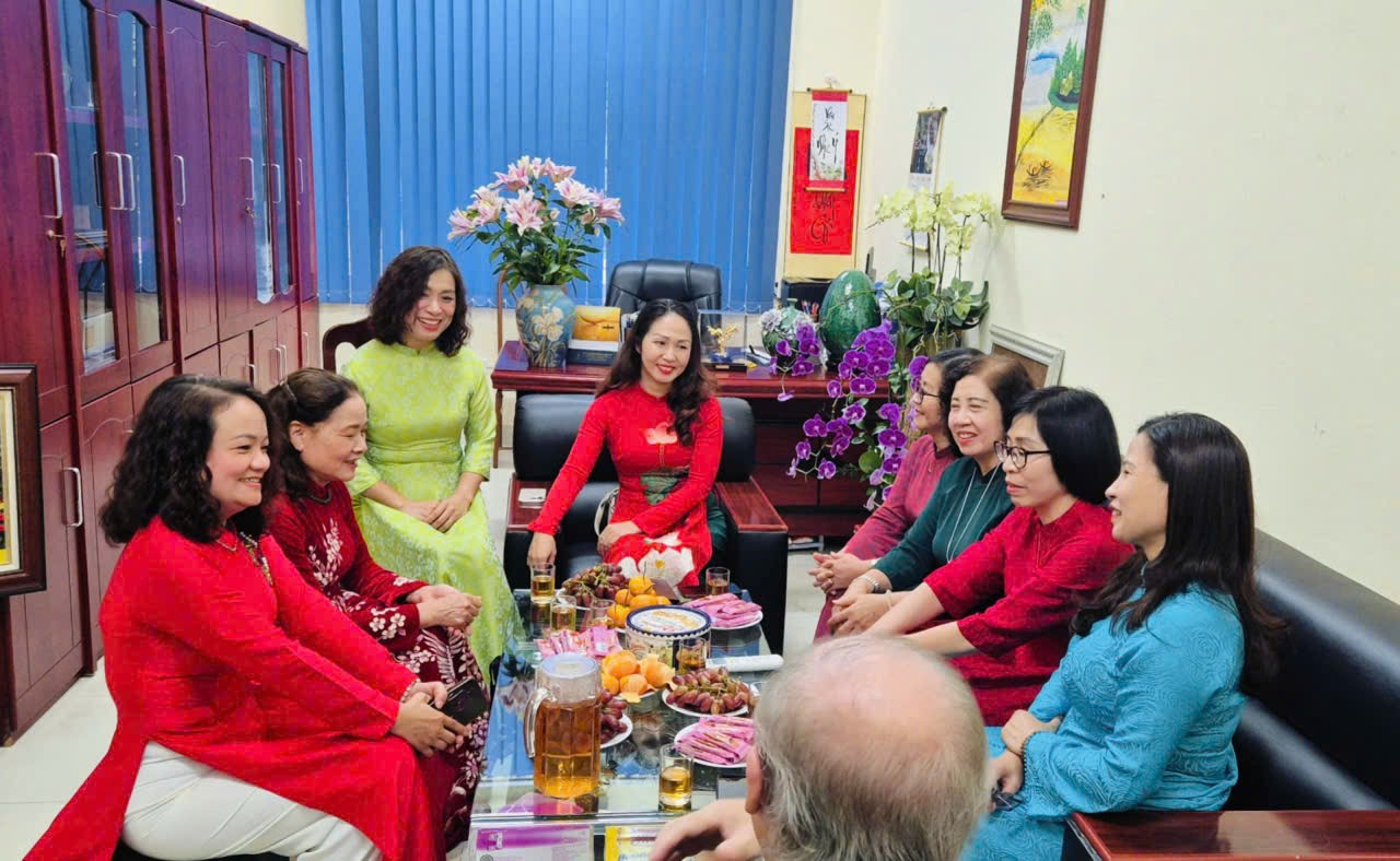 A group of women sitting around a tableDescription automatically generated