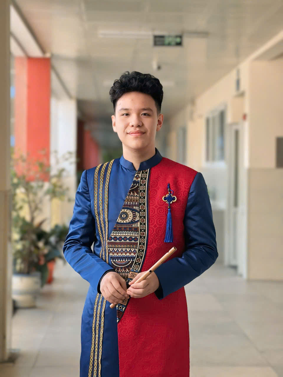 A person in a red and blue suitAI-generated content may be incorrect.