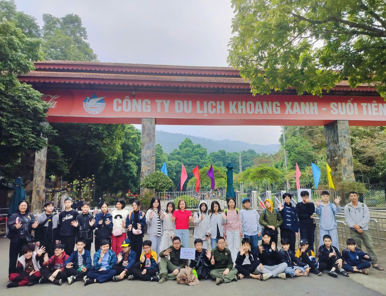 A group of people posing for a photo
Description automatically generated