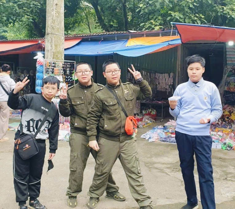 A group of people posing for a photo
Description automatically generated