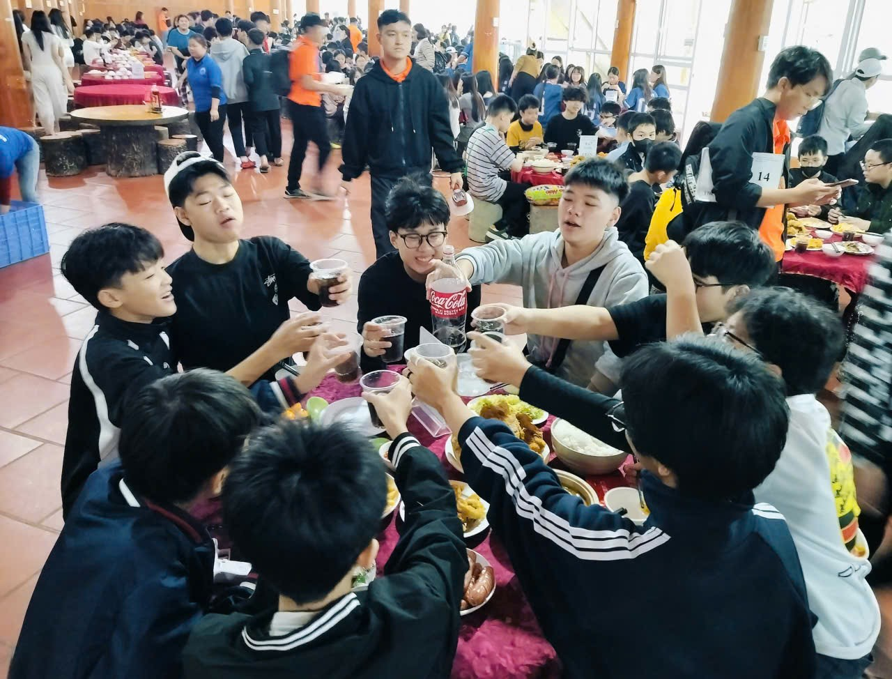 A group of people at a table with food
Description automatically generated