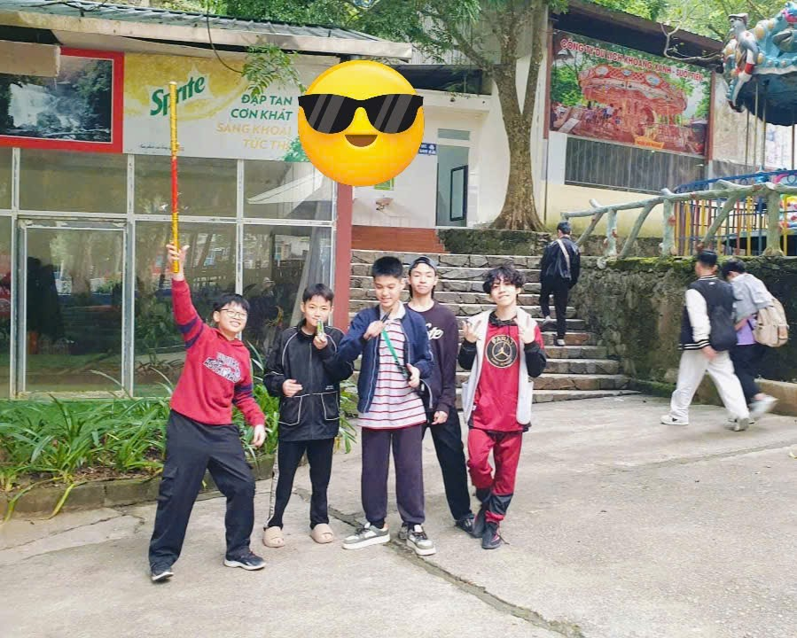 A group of people posing for a photo
Description automatically generated