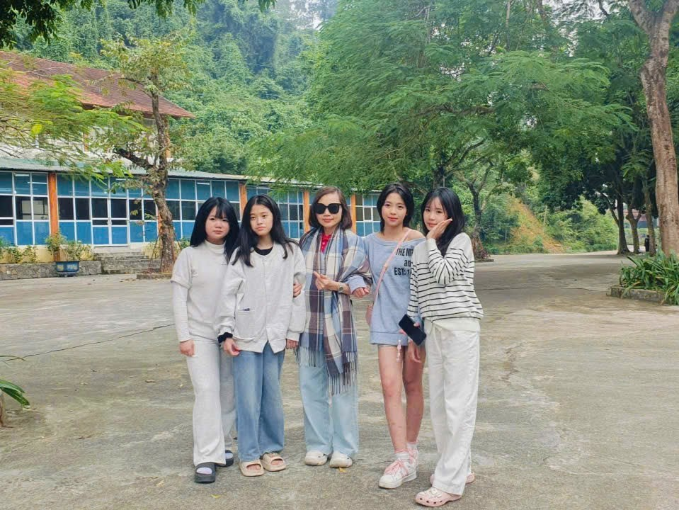 A group of girls posing for a photo
Description automatically generated