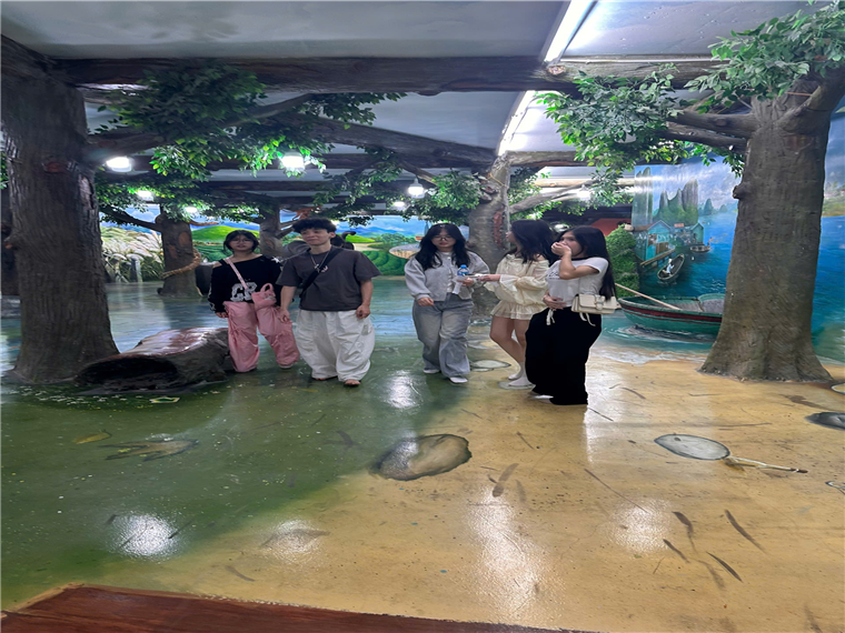 A group of people standing in a room with trees and a boat

AI-generated content may be incorrect.