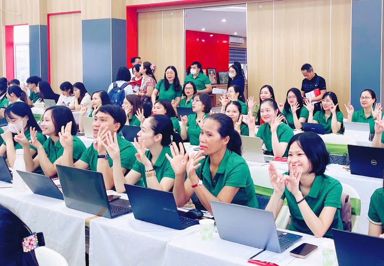 A group of people in green shirts

Description automatically generated