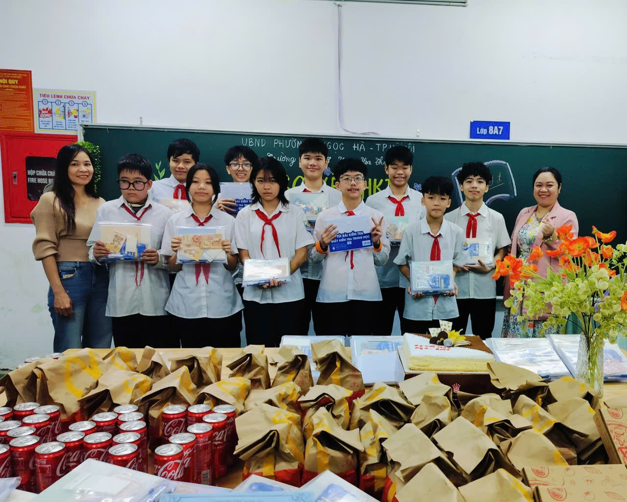 A group of people posing for a photo

Description automatically generated