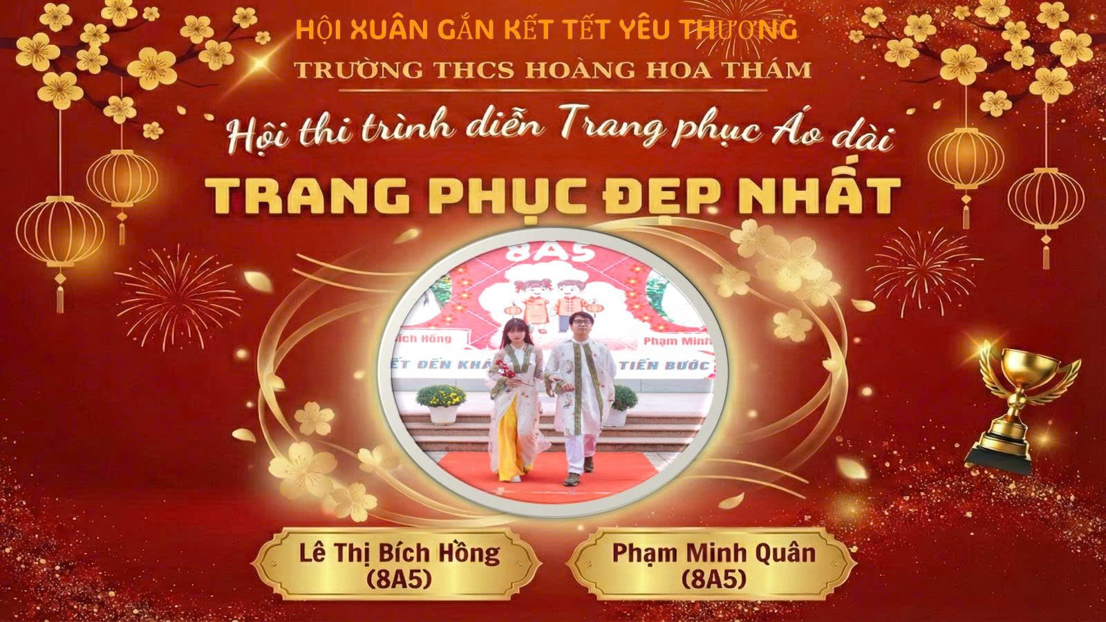 A person and person standing on a red carpet

Description automatically generated