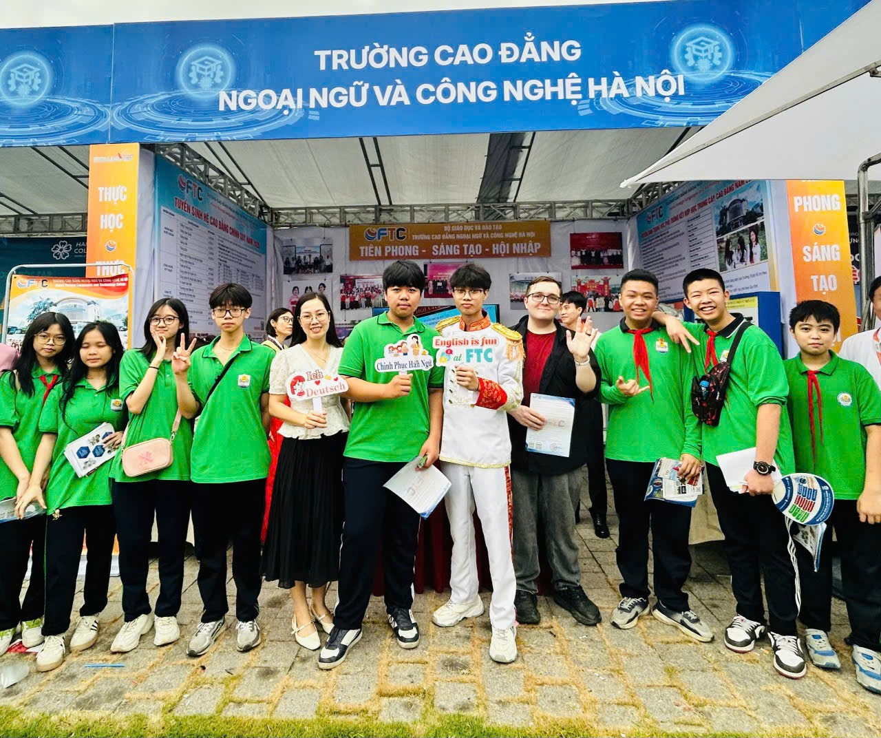 A group of people posing for a photo

Description automatically generated