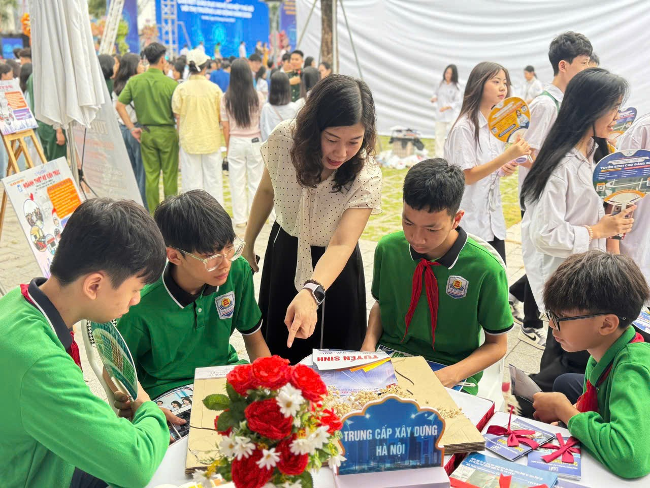 A group of people around a table

Description automatically generated