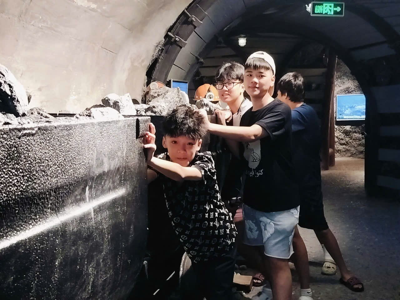 A group of people in a tunnel
Description automatically generated