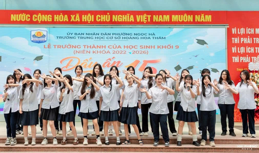 A group of girls standing on a stageDescription automatically generated