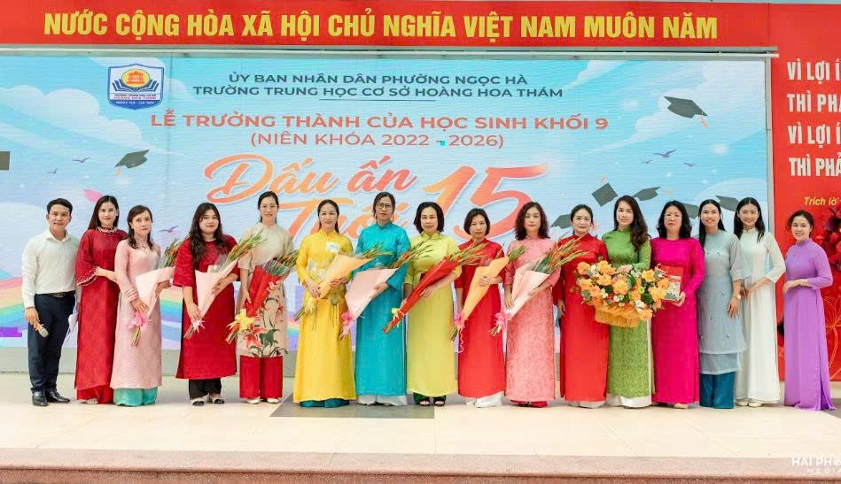 A group of women in colorful dresses holding flowersDescription automatically generated