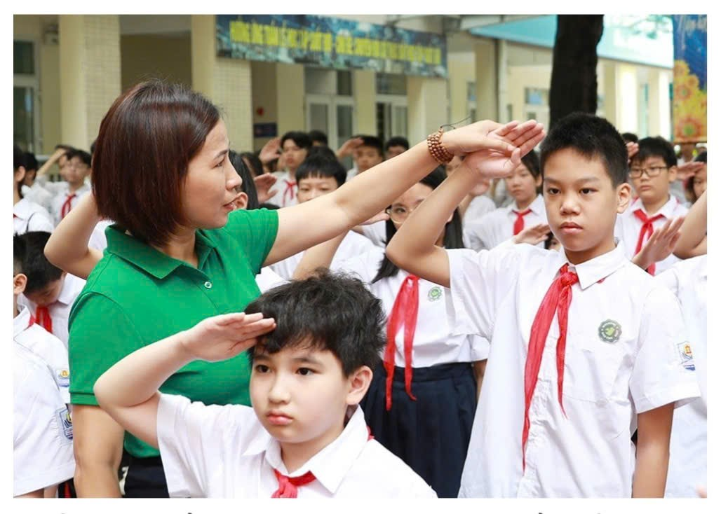 A person and children saluting

Description automatically generated