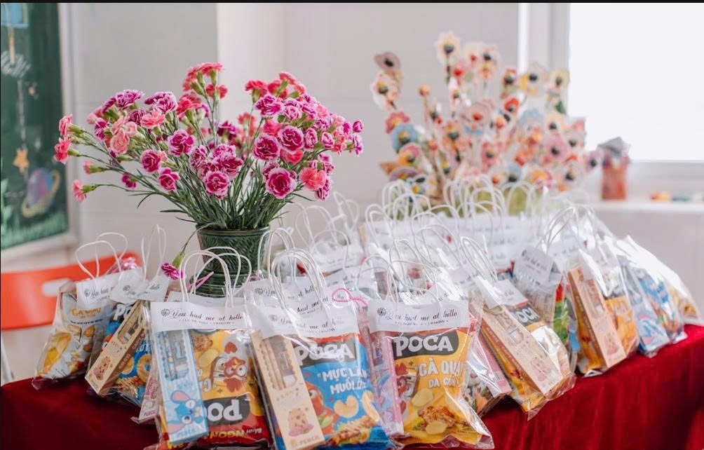 A group of bags of snacks and flowers

Description automatically generated
